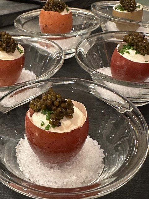Caviar served in the eggshell with whipped crème and coarse salt